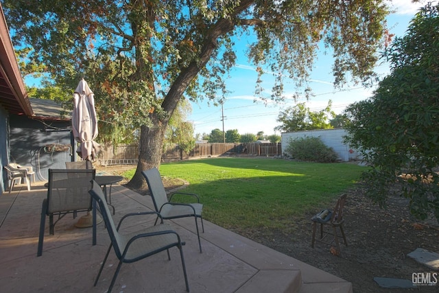 1041 Golden Gate Ave, Dos Palos, CA 93620 - view of patio / terrace featuring outdoor dining area and a fenced backyard
