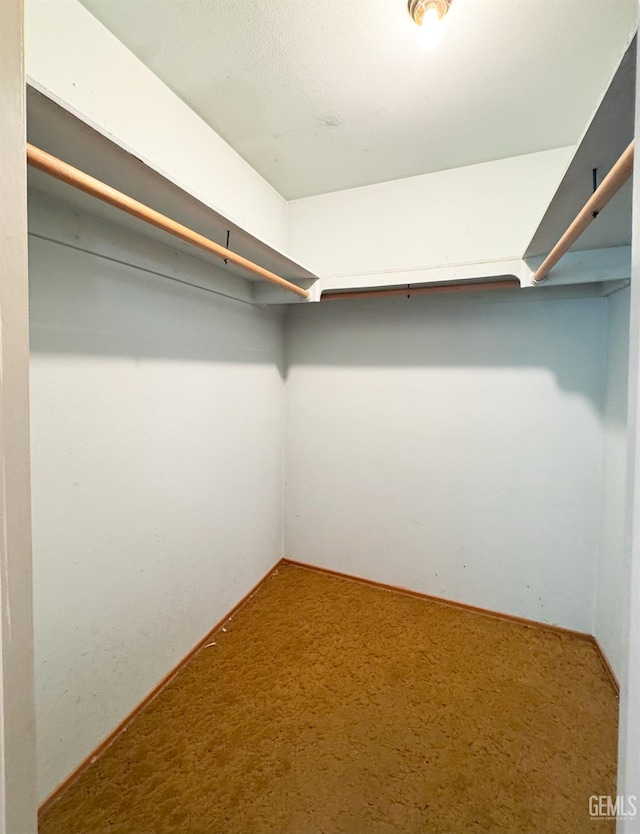 1041 Golden Gate Ave, Dos Palos, CA 93620 - spacious closet featuring carpet floors