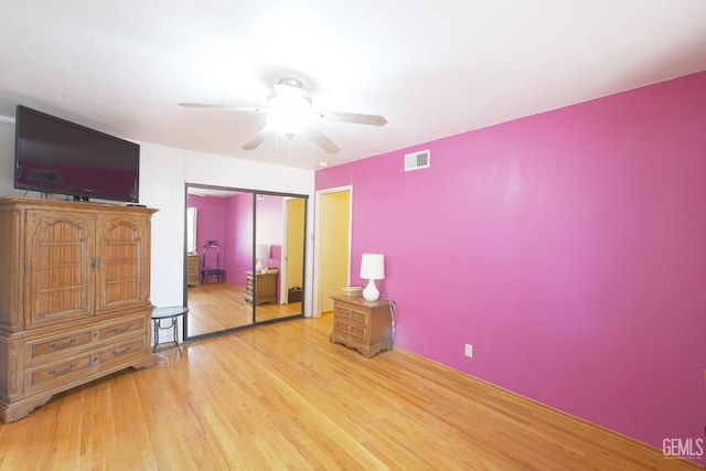 1041 Golden Gate Ave, Dos Palos, CA 93620 - bedroom with a ceiling fan, a closet, wood finished floors, and visible vents