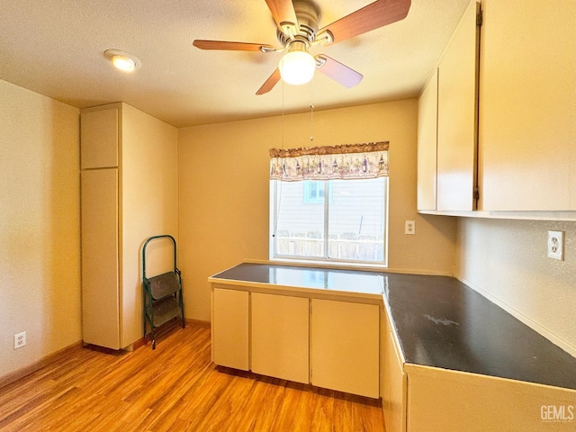 1041 Golden Gate Ave, Dos Palos, CA 93620 - kitchen featuring light wood-style floors, ceiling fan, and dark countertops