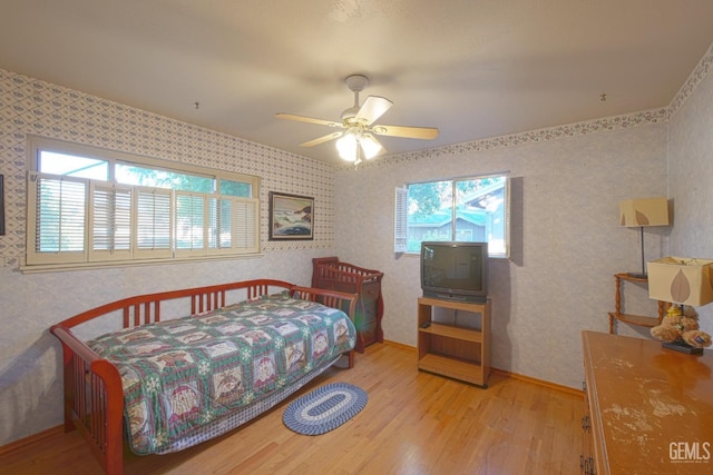 1041 Golden Gate Ave, Dos Palos, CA 93620 - bedroom featuring baseboards, a ceiling fan, wood finished floors, and wallpapered walls