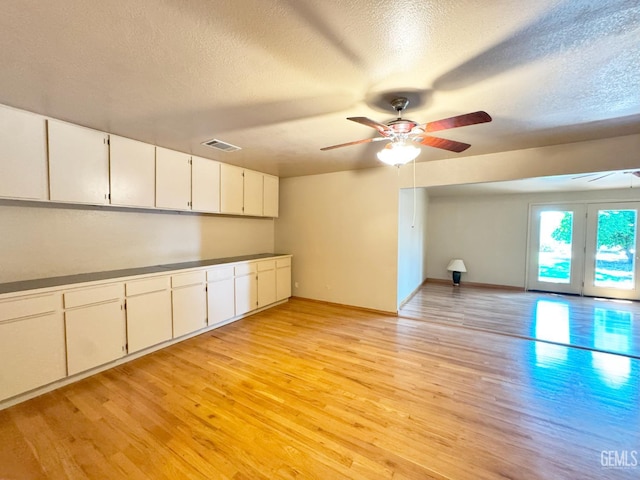1041 Golden Gate Ave, Dos Palos, CA 93620 - interior space with ceiling fan, light wood finished floors, and a textured ceiling