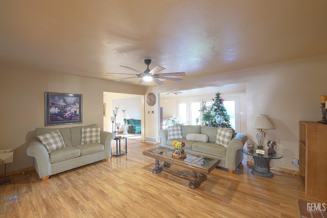 1041 Golden Gate Ave, Dos Palos, CA 93620 - living area featuring baseboards, a ceiling fan, and light wood-style flooring