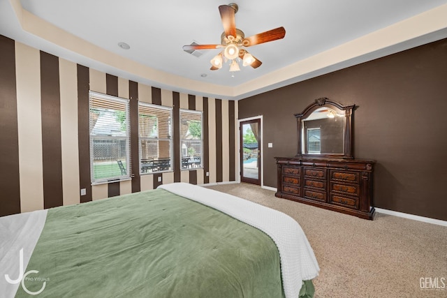 carpeted bedroom with baseboards, access to outside, and ceiling fan