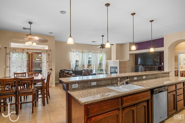 kitchen featuring visible vents, stainless steel dishwasher, open floor plan, and ceiling fan