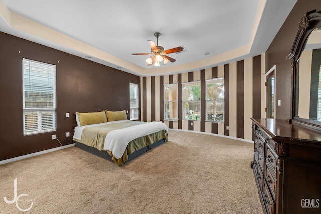 bedroom with carpet flooring, baseboards, and a ceiling fan