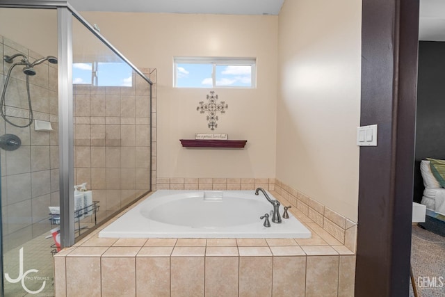 full bath with a shower stall and a garden tub