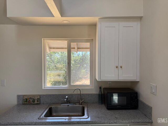 0 Rancheria Rd, Bakersfield, CA 93306 - kitchen featuring black microwave and white cabinets