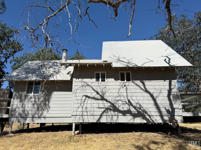 0 Rancheria Rd, Bakersfield, CA 93306 - view of side of home featuring a metal roof
