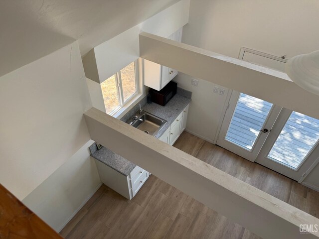 0 Rancheria Rd, Bakersfield, CA 93306 - unfurnished living room featuring light wood-type flooring and plenty of natural light