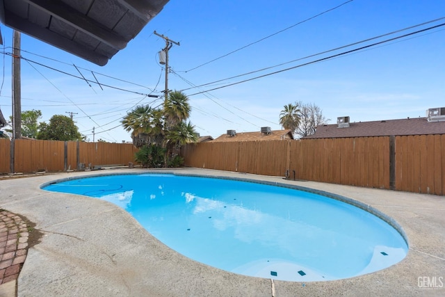 view of pool featuring a fenced backyard, a fenced in pool, and a patio