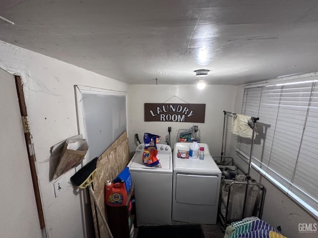 laundry area with washing machine and clothes dryer