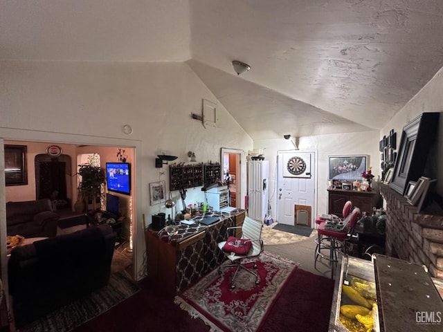 living room with carpet floors and vaulted ceiling