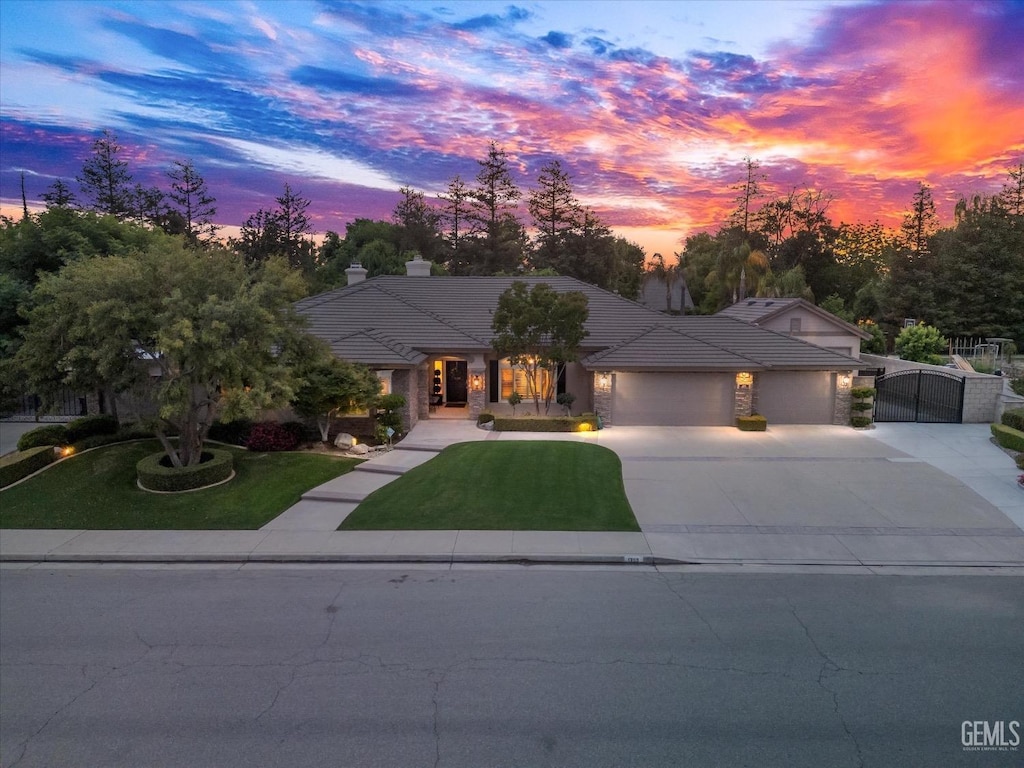 1309 Ensley Dr, Bakersfield, CA 93312 - view of front of house with a tile roof, a garage, a front lawn, and driveway