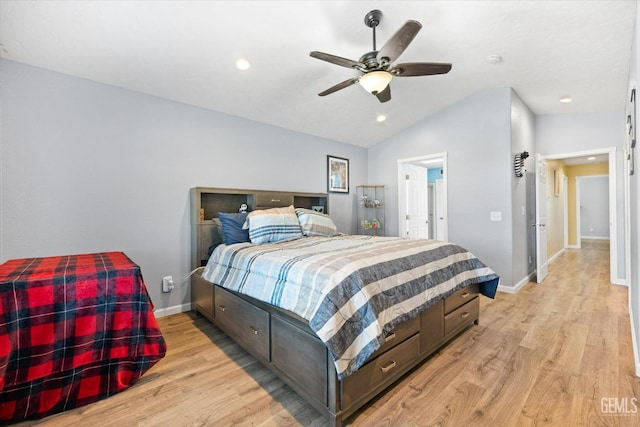 bedroom with vaulted ceiling, ceiling fan, and light hardwood / wood-style flooring