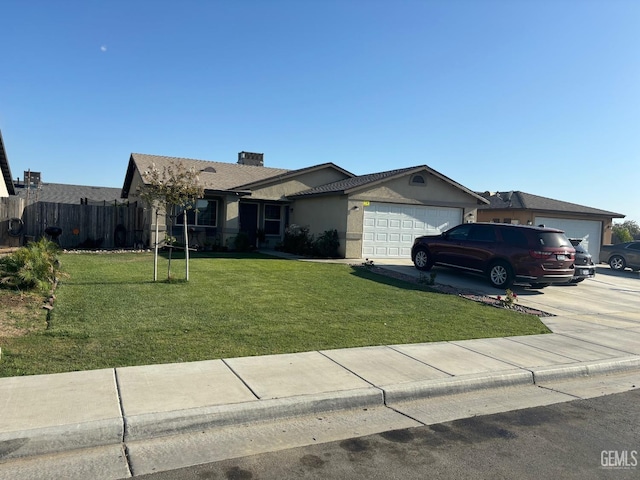 ranch-style house featuring a garage and a front lawn