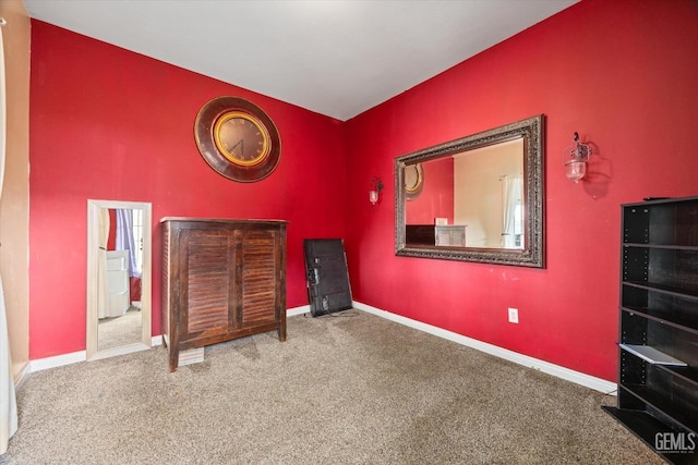 carpeted bedroom featuring baseboards