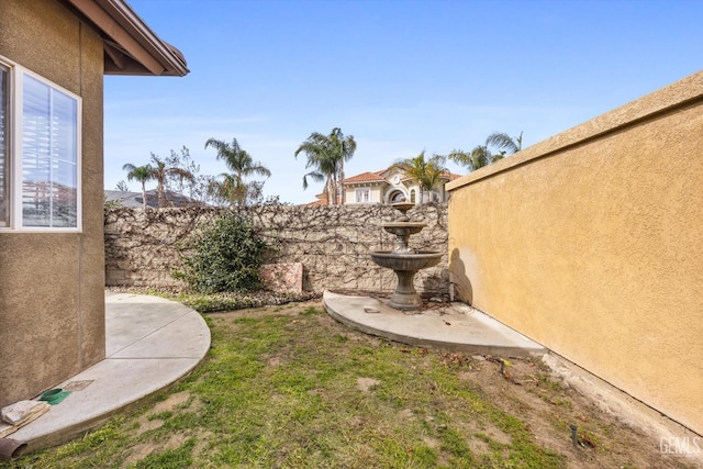 view of yard with a patio area and fence