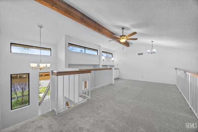 spare room featuring carpet flooring, vaulted ceiling with beams, a textured ceiling, and ceiling fan with notable chandelier