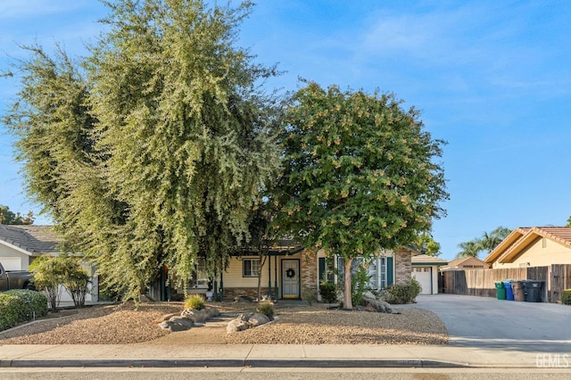 obstructed view of property featuring a garage