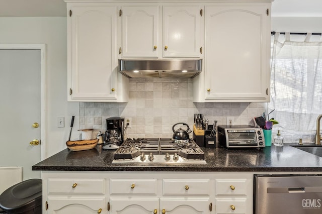 kitchen featuring white cabinets, backsplash, and stainless steel appliances