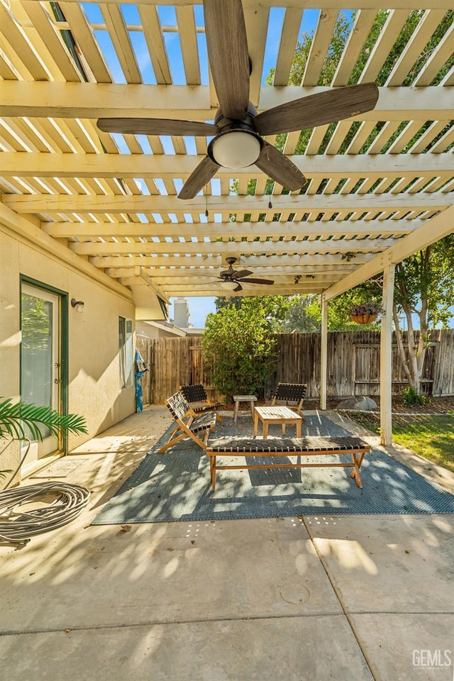 view of patio / terrace with ceiling fan and a pergola