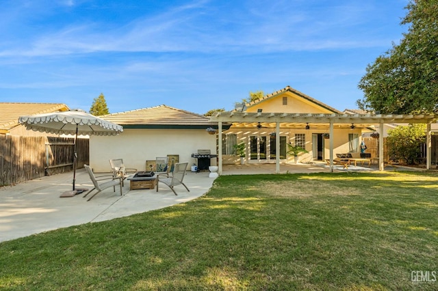 back of house featuring a pergola, a patio area, and a lawn