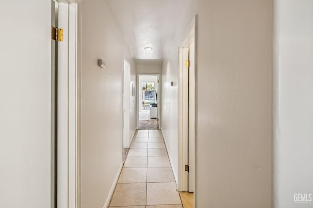 hallway featuring light tile patterned floors