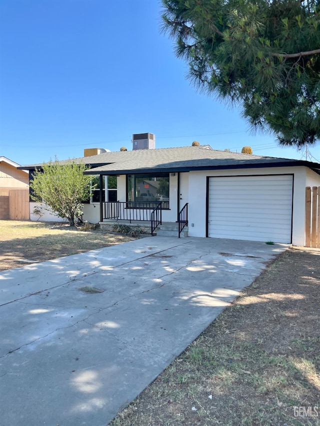 656 Minter Ave, Shafter, CA 93263 - single story home with a garage, stucco siding, concrete driveway, and a porch