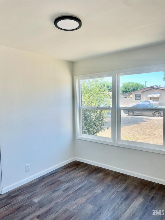 656 Minter Ave, Shafter, CA 93263 - unfurnished room featuring dark wood-style floors and baseboards