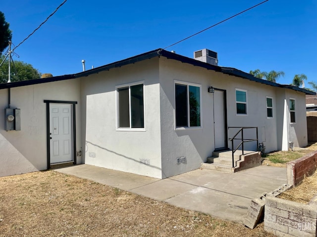 656 Minter Ave, Shafter, CA 93263 - rear view of property featuring stucco siding and a patio