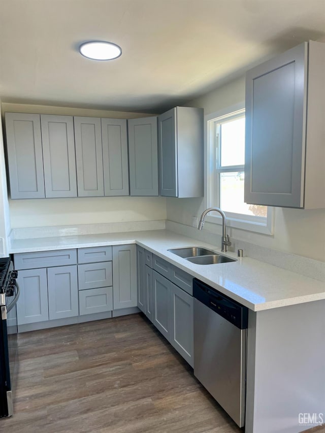 656 Minter Ave, Shafter, CA 93263 - kitchen featuring stainless steel appliances, light countertops, gray cabinets, and dark wood-type flooring