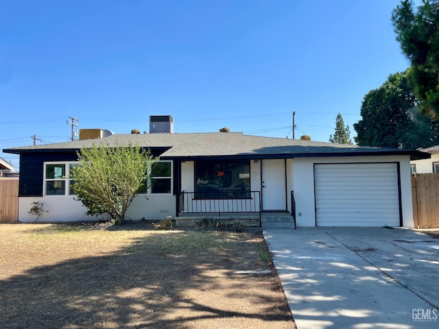 656 Minter Ave, Shafter, CA 93263 - ranch-style home with a garage, driveway, a porch, and stucco siding