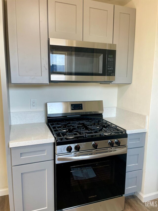 656 Minter Ave, Shafter, CA 93263 - kitchen featuring stainless steel appliances, gray cabinetry, and light wood-type flooring