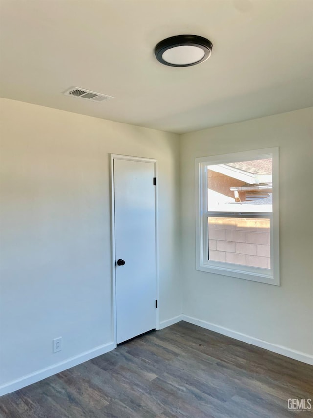 656 Minter Ave, Shafter, CA 93263 - unfurnished room featuring dark wood finished floors and baseboards