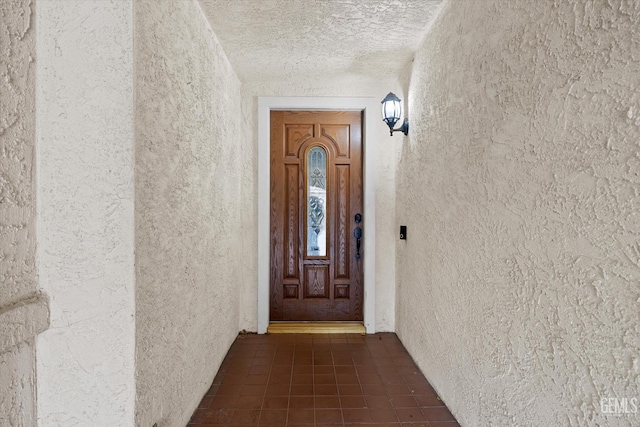 property entrance featuring stucco siding