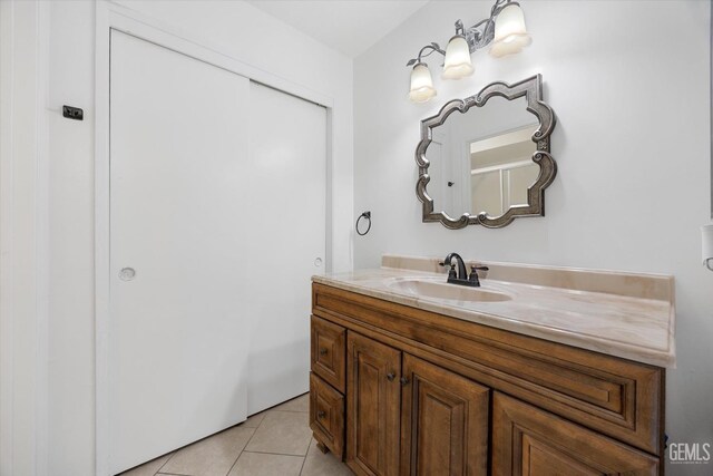 bathroom with tile patterned flooring and vanity