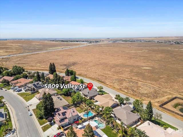 drone / aerial view with a rural view and a residential view