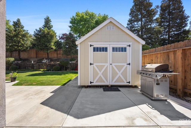 view of shed featuring a fenced backyard