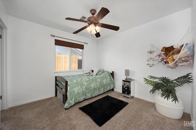 bedroom with carpet floors, a ceiling fan, baseboards, and visible vents