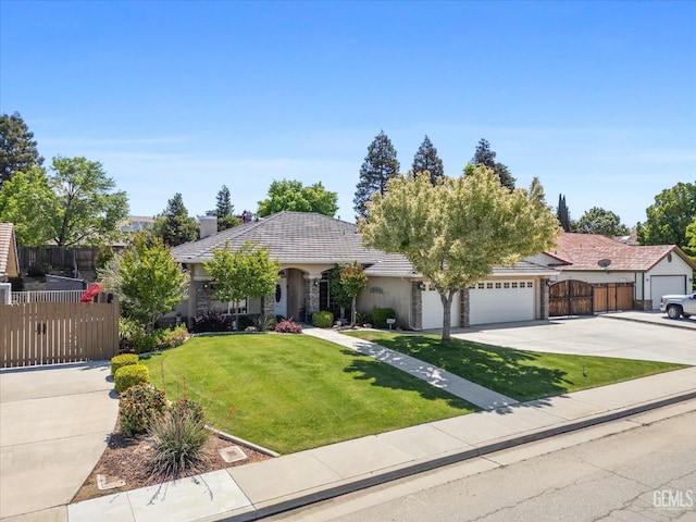 single story home featuring fence, a garage, a front yard, a chimney, and concrete driveway