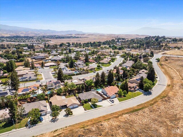 birds eye view of property with a residential view and a mountain view