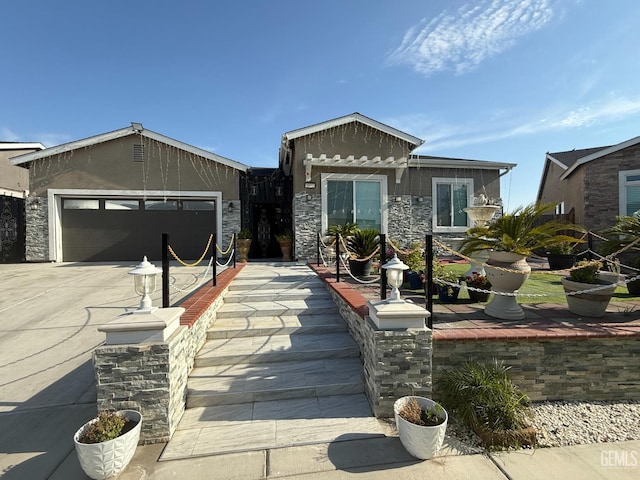 5917 Hawthorn Tree Ln, Bakersfield, CA 93313 - view of front facade featuring stone siding, driveway, and an attached garage