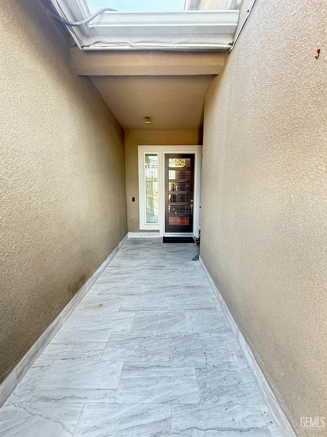 5917 Hawthorn Tree Ln, Bakersfield, CA 93313 - doorway to property featuring stucco siding