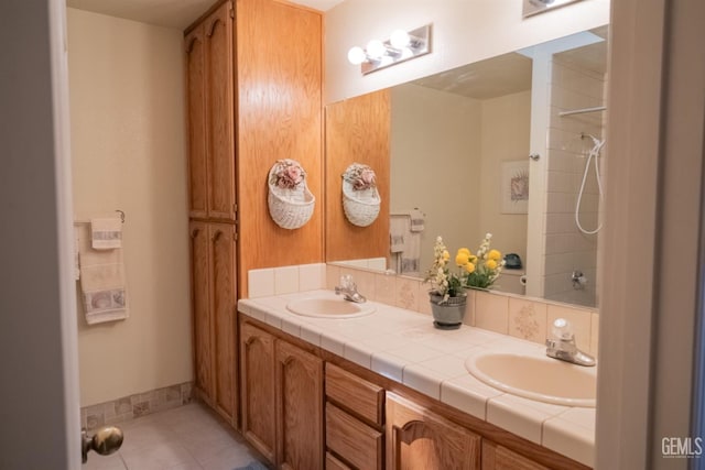 bathroom with tile patterned flooring and vanity