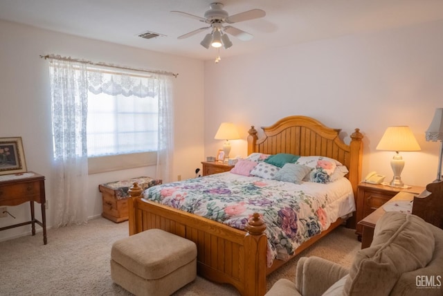 carpeted bedroom featuring ceiling fan