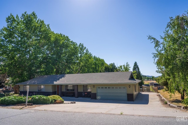 ranch-style home featuring a garage