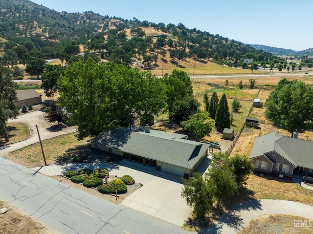 birds eye view of property with a mountain view