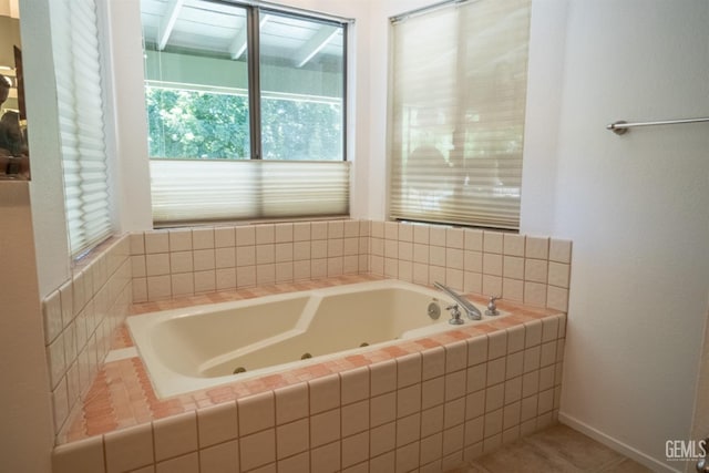 bathroom featuring tiled bath