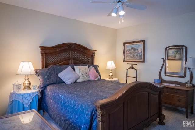 bedroom with ceiling fan and carpet floors